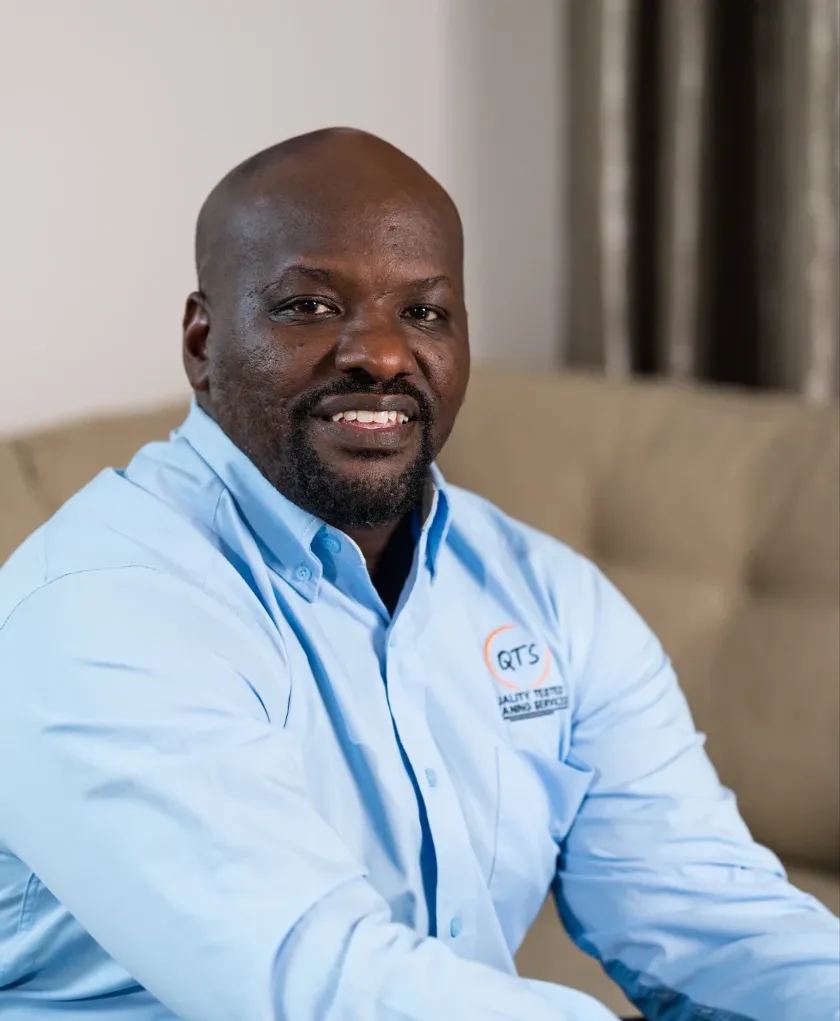 Terence Harris, founder of QTS Cleaning Academy, in a light blue QTS shirt